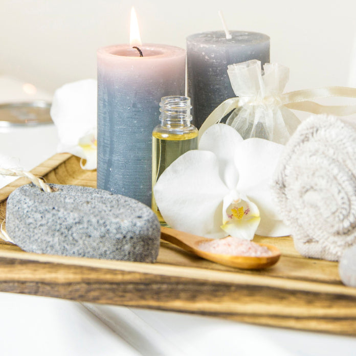 oils and candles by bathtub