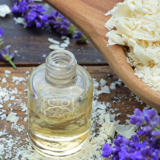 essential oil bottle with laundry soap and lavender