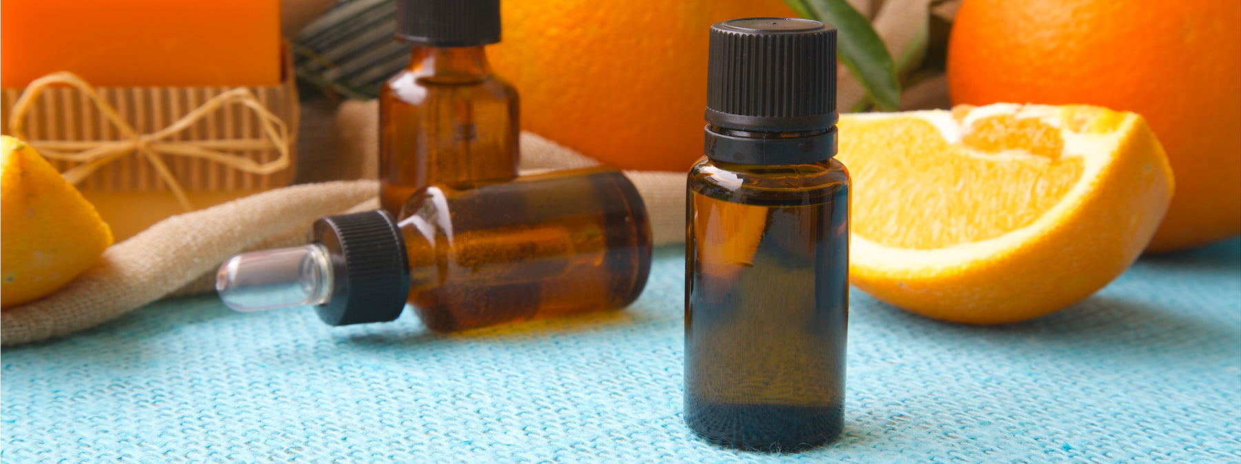 oil bottles with oranges and soap