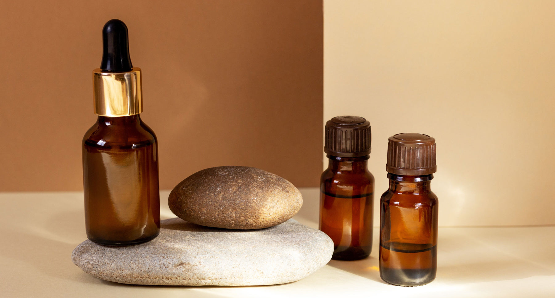 essential oil bottles on stones