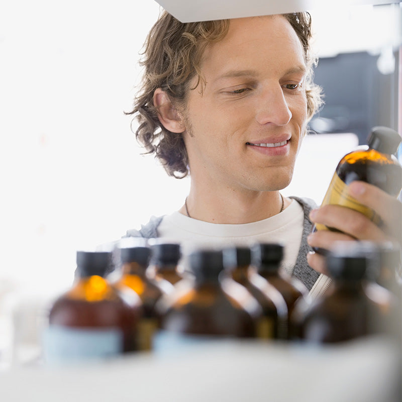 Man selecting essential oils