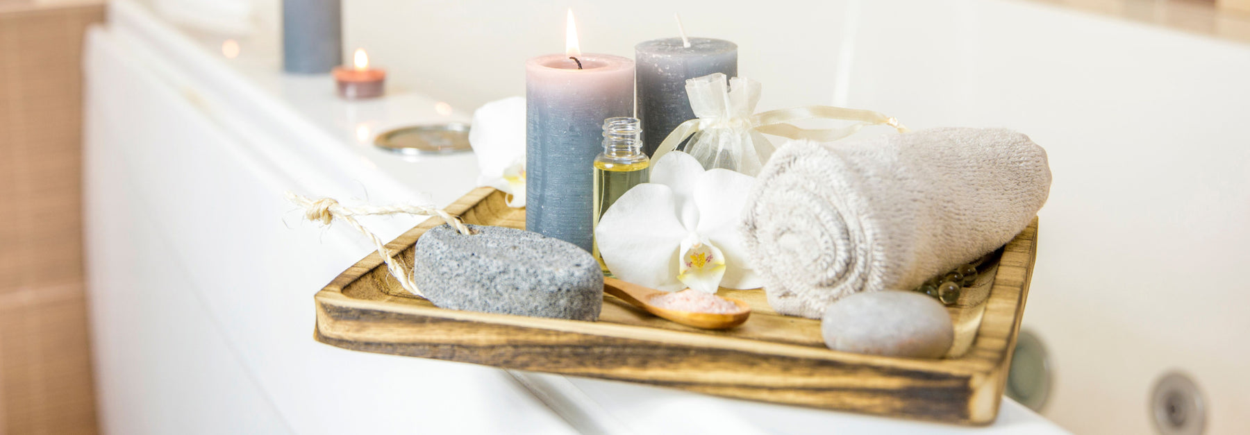 oils and candles by bathtub